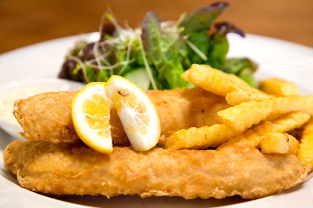 Fish and chips on a white plate