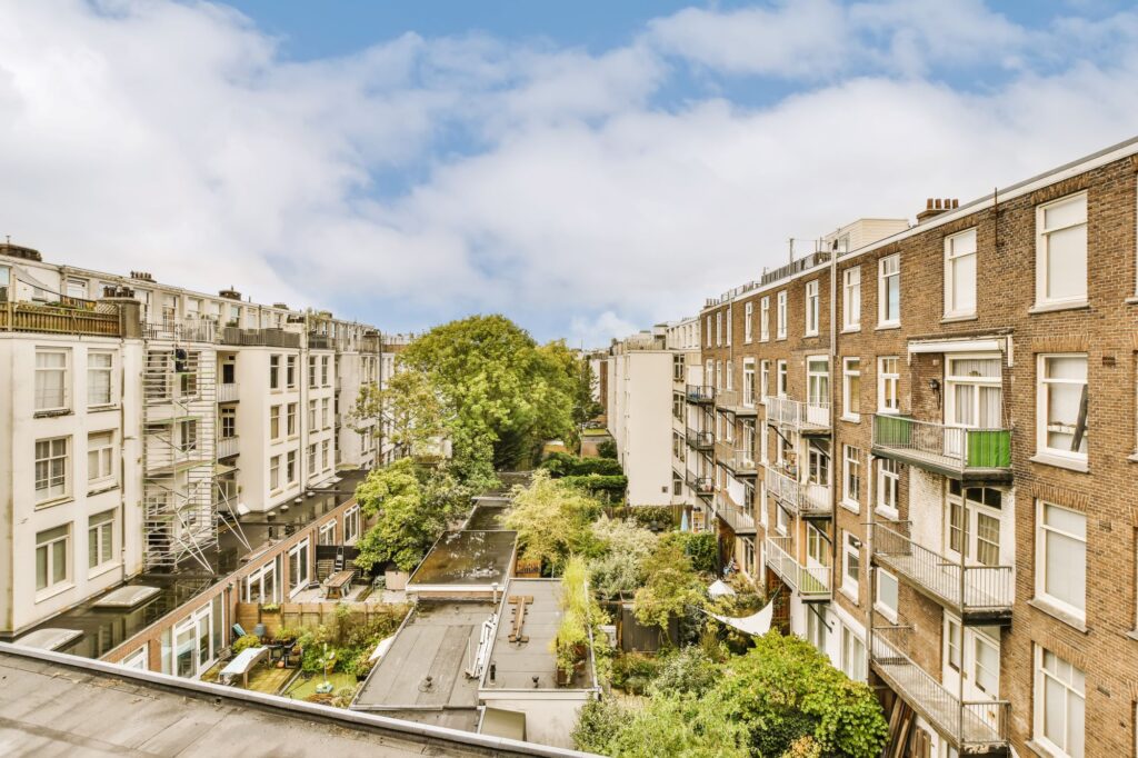 The view of a residential street from a rooftop.