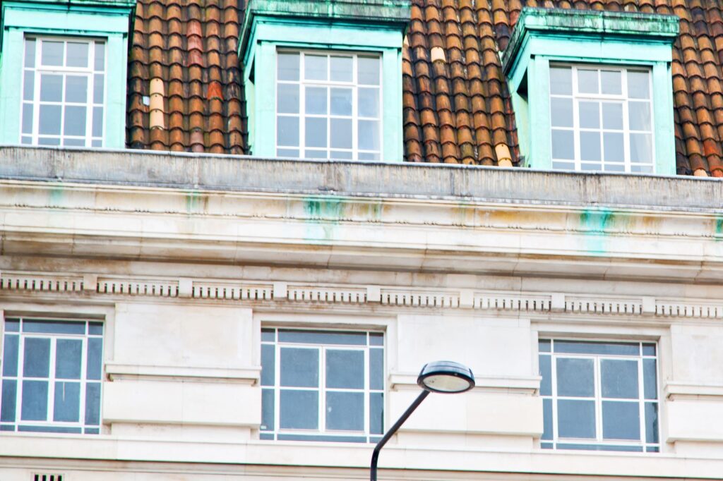 The top of an old apartment building in London.