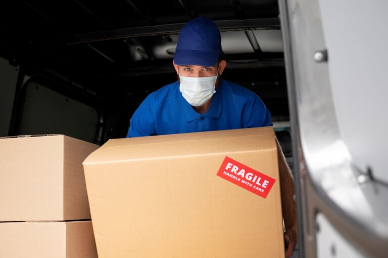 An office mover inside an office relocation truck in the concept of 'what are office removals services'.